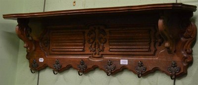 Lot 1322 - A Continental style carved oak coat rack