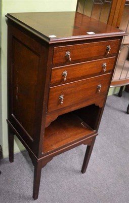 Lot 1326 - An Edwardian mahogany music cabinet with three drawers