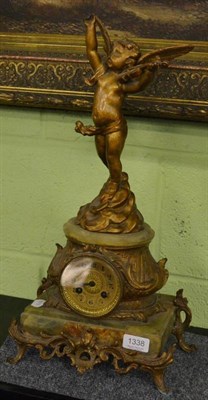 Lot 1338 - A spelter cherub and onyx mantel clock