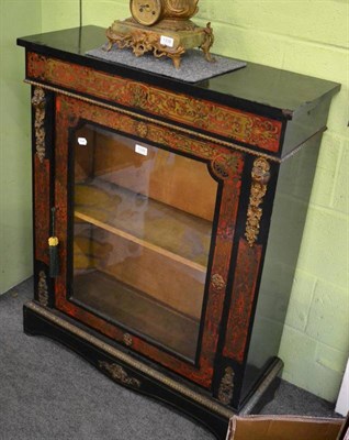 Lot 1339 - An Empire style ebonised and red boulle glazed cabinet with gilt metal mounts