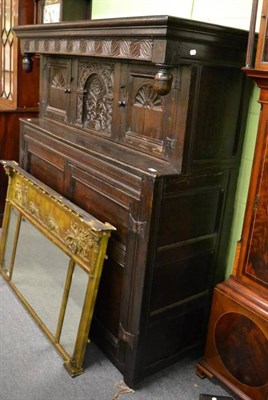 Lot 1342 - An 18th century carved oak court cupboard