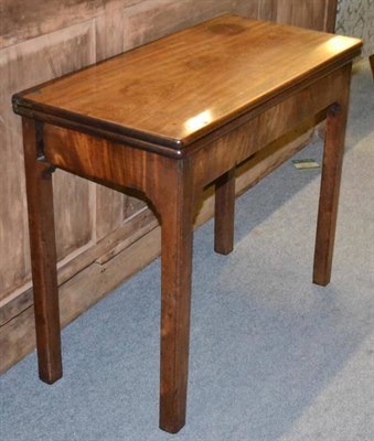 Lot 1354 - A George III mahogany rectangular foldover tea table