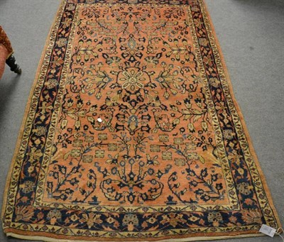 Lot 1361 - Saroukh rug, West Persia, the rust ground with flowering boughs enclosed by indigo borders of...