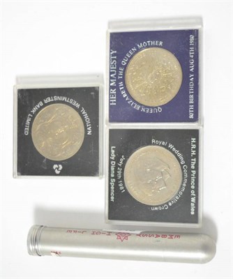 Lot 35 - A collection of silver threepences in a cigar tube and three crowns