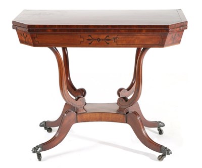 Lot 754 - A Regency Mahogany and Ebony Strung Foldover Tea Table, early 19th century, of canted...