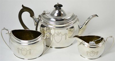 Lot 91 - An early 20th century silver three piece tea set by Goldsmiths & Silversmiths Co Ltd, London 1905