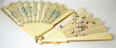 Lot 102 - An early 20th century ivory fan with silk mount embroidered in blue and cream silks with 18th...