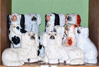 Lot 111 - A five pairs of Staffordshire pottery seated spaniels and one other (11)