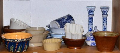 Lot 125 - Blue and white pottery and a collection of stoneware and pottery jelly moulds