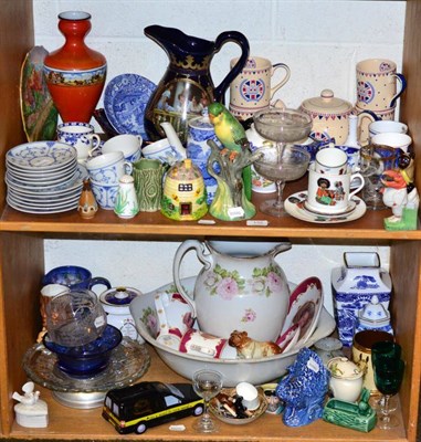 Lot 132 - Two shelves of decorative ceramics and glass including Berlin teawares, toilet jugs, figures, etc