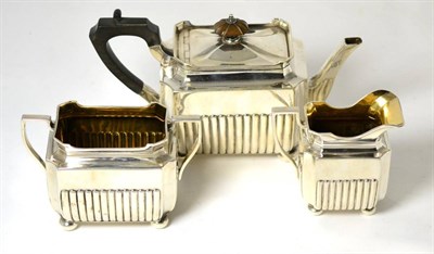 Lot 147 - An Elkington three piece silver tea set, of ribbed rectangular form, Birmingham 1896/97