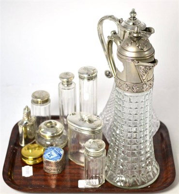 Lot 153 - A group of silver topped dressing table jars together with two silver plate mounted claret...