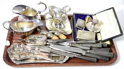 Lot 155 - A tray of plated items including two candle snuffers and stands, horn handled knives, a silver...
