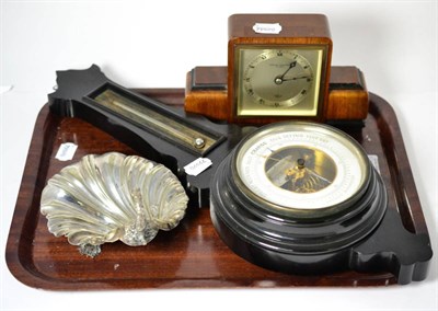 Lot 167 - Two trays of silver plated ware, an Elliott mantel clock, an aneroid barometer etc