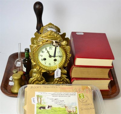 Lot 170 - Mixed lot including a gilt metal mantel clock, a hand bell, three weights, three books about...