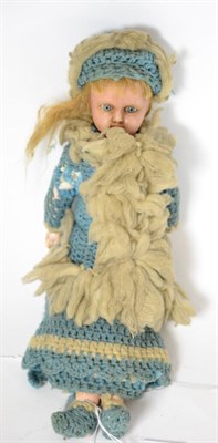 Lot 198 - Wax head shoulder doll with composition body, blue glass eyes, blonde wig, wearing knitted coat and