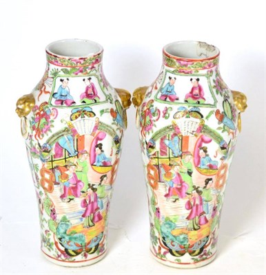 Lot 200 - A pair of Cantonese baluster vases, mid 19th century, with mask and loop handles, painted in...