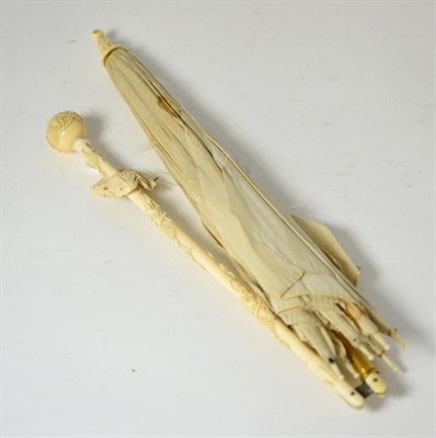 Lot 205 - A 19th century ivory handled folding parasol by signed Verdier, carved with vine and grapes,...