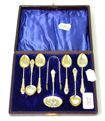 Lot 230 - A late Victorian silver tea spoon, sugar tongs and spoon set, Birmingham 1900, cased