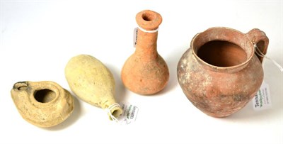 Lot 244 - A Roman terracotta jug 3rd/5th century AD, 10cm high, together with a Roman terracotta oil lamp...