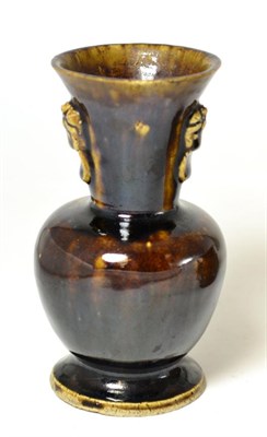 Lot 247 - A Chinese Han style monochrome brown pottery vase, possibly late Ming Dynasty, having tapering...