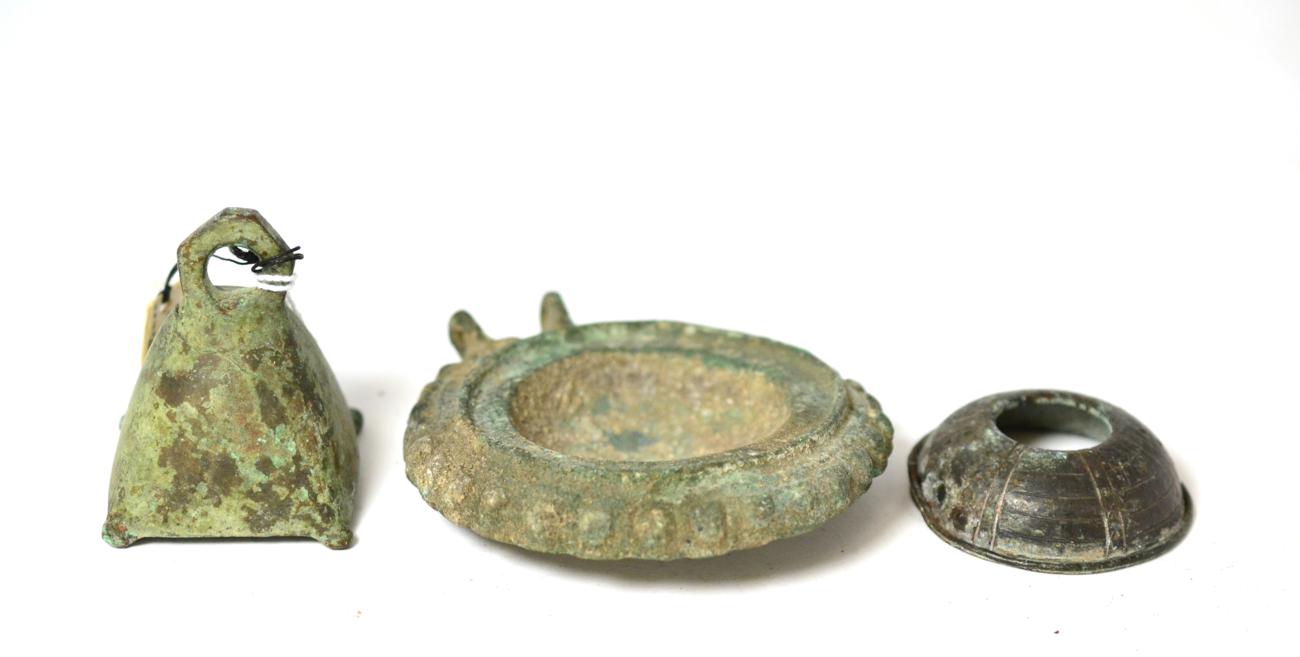 Lot 250 - A Roman bronze weight, circa 1st century AD, of flared form now missing lead, 5cm high, bears label