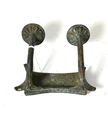 Lot 251 - A Roman bronze bracket with decorated handle like supports, circa 1st-2nd century AD, the...