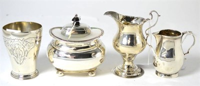 Lot 254 - An Art Nouveau vase, two silver jugs and a sugar basin