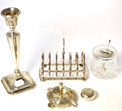 Lot 258 - A silver candlestick (weighted), silver snuff box, silver ashtray, silver topped preserve jar...