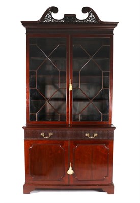 Lot 779 - A George III Style Mahogany Bookcase, 3rd quarter 19th century, the fret carved swan neck...