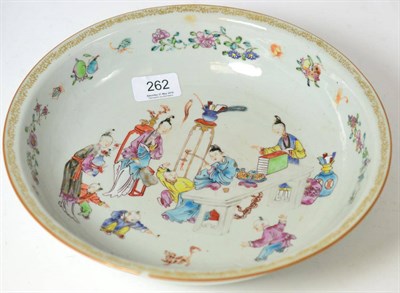 Lot 262 - A Chinese Export famille rose shallow bowl painted with ladies and children playing (a.f.)