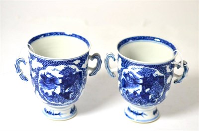 Lot 288 - A pair of Chinese porcelain Twin-Handled goblets, Qianlong, of bell form, painted in underglaze...