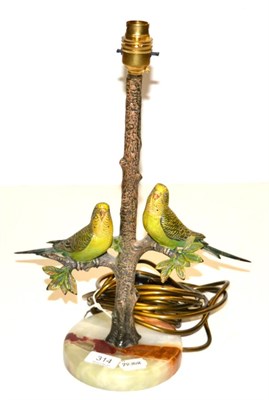 Lot 314 - A cold painted bronze table lamp base modelled as two budgerigar on branches on an onyx plinth base