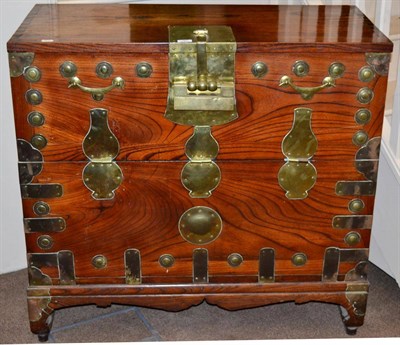 Lot 787 - A Korean Elm and Brass Bound Chest, late 19th/early 20th century, with fall front and...