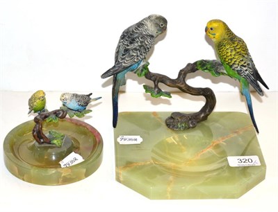 Lot 320 - An onyx ashtray surmounted by a pair of cold painted bronze budgerigars and a similar larger...