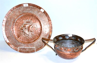 Lot 322 - A W.H.Mawson of Keswick twin-handled copper vessel and an Arts and Crafts charger, decorated with a