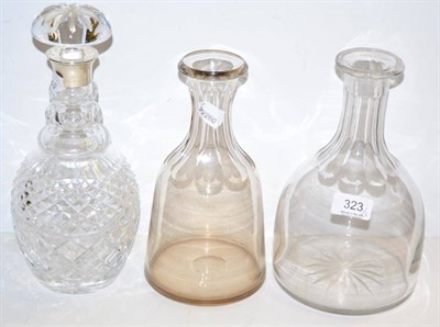 Lot 323 - Two glass carafes and a silver mounted crystal decanter