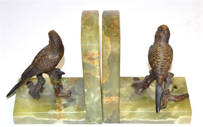 Lot 330 - A pair of onyx bookends each surmounted by cold painted bronze budgerigar  Provenance: By...