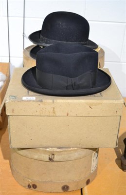 Lot 1023 - Two top hats, two bowler hats and a Scotts & Co hat (in four original card hat boxes)