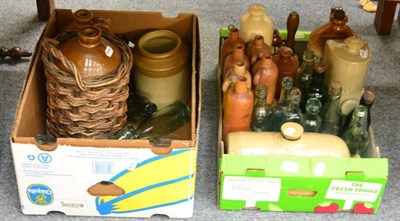 Lot 1067 - A large collection of glazed stoneware jars, glass bottles, ARP brass bell, hot water bottles...