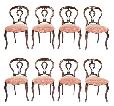 Lot 806 - A Set of Eight Victorian Rosewood Dining Chairs, circa 1870, with C scroll carved splats above...