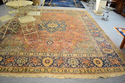 Lot 1091 - An Oriental carpet, probably Tabriz North West Persia, the candy field of scrolling vines...