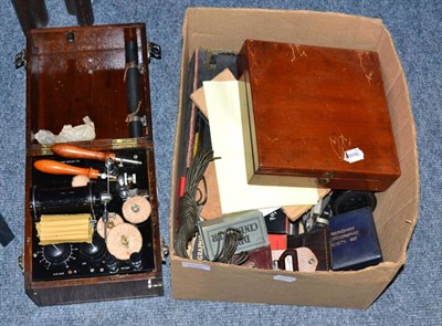 Lot 1097 - Electric Shock Machine, battery powered, in mahogany case mark H M Govt.; a set of Opticians Lenses