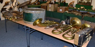 Lot 1099 - Ten brass instrument including a sousaphone and drum