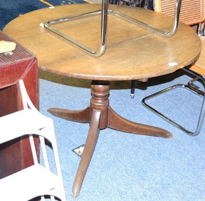 Lot 1106 - A 19th century oak circular top tripod table