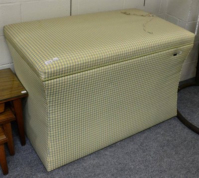 Lot 1114 - A large green checked ottoman containing a lift mechanism for a television