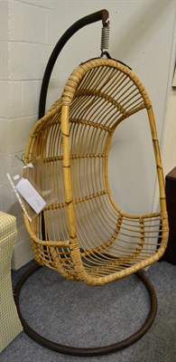 Lot 1115 - A 1970s free swinging rattan and bamboo egg chair