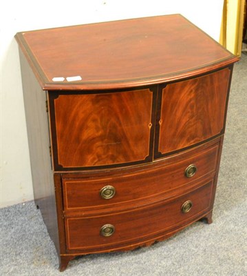 Lot 1116 - A small chest of drawers in the form of a commode cupboard