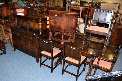 Lot 1119 - A group of furniture comprising an oak draw leaf dining table together with six chairs...