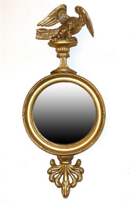 Lot 813 - A Regency Gilt and Gesso Convex Wall Mirror, circa 1800, the moulded frame with an anthemion...